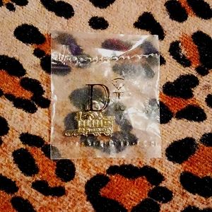 Diamond International Gold Train charm, new in bag